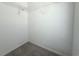 Walk-in closet with white walls, carpeted floor, and wire shelving at 11622 Declaration Dr, Tampa, FL 33635
