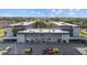 An aerial view of a multi-unit apartment complex featuring covered parking and lush landscaping at 1225 58Th N St # 204A, St Petersburg, FL 33710