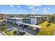 An aerial view of well-maintained apartments with covered parking, surrounded by lush greenery at 1225 58Th N St # 204A, St Petersburg, FL 33710