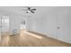 Bedroom featuring wood floors, ceiling fan, a closet and a bright window at 1225 58Th N St # 204A, St Petersburg, FL 33710