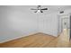 A bright bedroom featuring wood floors, ceiling fan and a white closet door at 1225 58Th N St # 204A, St Petersburg, FL 33710