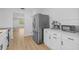 Bright kitchen featuring stainless steel appliances and white cabinets with plenty of counter space at 1225 58Th N St # 204A, St Petersburg, FL 33710