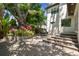 Landscaped backyard featuring a patio and outdoor dining set, perfect for entertaining guests at 134 Chesapeake Ave, Tampa, FL 33606