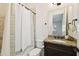 Bathroom featuring a vanity with granite counters and a shower with white shower curtain at 134 Chesapeake Ave, Tampa, FL 33606