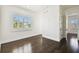 Bright bedroom with hardwood floors, white walls, and window with plantation shutters at 134 Chesapeake Ave, Tampa, FL 33606