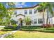 Attractive two-story home with manicured lawn, lush landscaping, and a tile roof at 134 Chesapeake Ave, Tampa, FL 33606