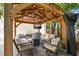 Outdoor gazebo featuring comfortable seating, an outdoor television and decorative lighting at 134 Chesapeake Ave, Tampa, FL 33606
