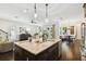 Open kitchen with a large central island, dual sinks, and views of living areas at 134 Chesapeake Ave, Tampa, FL 33606