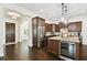 Modern kitchen with wooden cabinetry, stainless steel appliances, and large center island at 134 Chesapeake Ave, Tampa, FL 33606