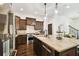 Bright kitchen with stainless steel appliances, granite island, and view of staircase at 134 Chesapeake Ave, Tampa, FL 33606