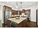 Spacious kitchen featuring granite countertops, custom cabinets, and a stainless steel refrigerator at 134 Chesapeake Ave, Tampa, FL 33606