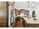 Updated kitchen featuring stainless steel appliances, wooden floors, and granite countertops at 134 Chesapeake Ave, Tampa, FL 33606