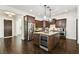 Gourmet kitchen boasts a large island, stainless steel appliances, and elegant pendant lighting at 134 Chesapeake Ave, Tampa, FL 33606