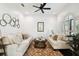 Cozy living room with neutral sofas, soft lighting, and decorative artwork at 134 Chesapeake Ave, Tampa, FL 33606