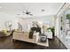 Bright living room with dark hardwood floors, high ceilings, and outdoor access at 134 Chesapeake Ave, Tampa, FL 33606