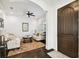 Bright living room with hardwood floors, ceiling fan, and elegant neutral-toned furniture at 134 Chesapeake Ave, Tampa, FL 33606