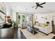 Bright living room with dark hardwood floors, and large windows to the backyard at 134 Chesapeake Ave, Tampa, FL 33606