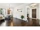 Open-concept living room with hardwood floors and access to dining room and front door at 134 Chesapeake Ave, Tampa, FL 33606