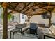 Inviting outdoor seating area under a covered pergola with a ceiling fan and outdoor television at 134 Chesapeake Ave, Tampa, FL 33606