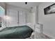 Bright bedroom with closet and television at 13539 Carryback Dr, Dade City, FL 33525