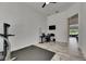 Bright, open room with a work area and a view to green grass and trees at 13539 Carryback Dr, Dade City, FL 33525