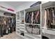 Spacious walk-in closet with custom shelving and ample storage for clothes and accessories at 13539 Carryback Dr, Dade City, FL 33525
