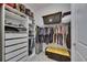 Walk-in closet with plenty of storage space, including shelving and rods for hanging clothes at 13539 Carryback Dr, Dade City, FL 33525