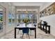 Bright dining area showcasing backyard views, comfortable seating, and natural light, perfect for Gathering meals at 13539 Carryback Dr, Dade City, FL 33525