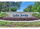 Lake Jovita entrance sign surrounded by landscaping and shrubbery at 13539 Carryback Dr, Dade City, FL 33525
