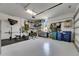 Clean garage with hanging storage and exercise equipment at 13539 Carryback Dr, Dade City, FL 33525
