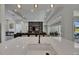 Modern kitchen island with sink and view to the Gathering room beyond at 13539 Carryback Dr, Dade City, FL 33525