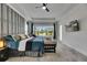 Main bedroom features a large window, accent seating, and recessed lighting at 13539 Carryback Dr, Dade City, FL 33525