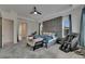 A spacious main bedroom with a massage chair, comfortable furnishings, and serene ambiance at 13539 Carryback Dr, Dade City, FL 33525