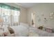 Cozy bedroom with coordinated décor, playful accents and ensuite bathroom at 15314 Sherwood Forest Dr, Tampa, FL 33647