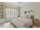 Inviting bedroom with a large window, built-in shelving, and neutral decor at 15314 Sherwood Forest Dr, Tampa, FL 33647