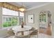 Cozy breakfast nook featuring a round table, modern decor, and large windows at 15314 Sherwood Forest Dr, Tampa, FL 33647