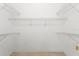 Empty closet with wire shelving, offering ample storage space at 15314 Sherwood Forest Dr, Tampa, FL 33647