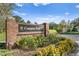 Compton Park brick community entrance sign accented with colorful landscaping, shrubs, and green grass at 15314 Sherwood Forest Dr, Tampa, FL 33647