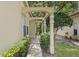 Covered walkway featuring decorative columns and views of lush landscaping at 15314 Sherwood Forest Dr, Tampa, FL 33647