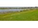 Lush backyard with a serene lake that offers tranquil views and natural beauty at 15426 Wicked Strong St, Sun City Center, FL 33573