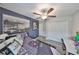 This bedroom features a ceiling fan, a window, a closet, and light gray plank flooring at 15426 Wicked Strong St, Sun City Center, FL 33573