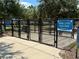 Fenced dog park area with separate sections for small and large dogs, offering a safe and fun space at 15426 Wicked Strong St, Sun City Center, FL 33573