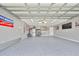 This garage features an epoxy floor and storage cabinets at 15426 Wicked Strong St, Sun City Center, FL 33573