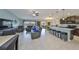 Open-concept living space featuring a spacious kitchen, dining area, and comfortable living room at 15426 Wicked Strong St, Sun City Center, FL 33573