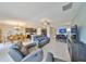 A spacious open-concept layout connecting the living room, dining area, and kitchen with lots of natural light at 15426 Wicked Strong St, Sun City Center, FL 33573