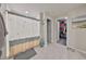 Bright main bathroom with a walk-in shower and walk-in closet at 15426 Wicked Strong St, Sun City Center, FL 33573