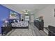 This main bedroom features a ceiling fan, an ensuite bathroom, and a large closet for optimal storage at 15426 Wicked Strong St, Sun City Center, FL 33573