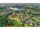 Expansive aerial view of a luxury home with a pool and a large backyard at 17305 Ballmont Park Dr, Odessa, FL 33556