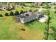Expansive backyard features a large screened-in pool area, verdant lawn, and mature landscaping in a premier neighborhood at 17305 Ballmont Park Dr, Odessa, FL 33556