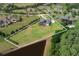 Sprawling property featuring a luxury home with a large lawn and pond at 17305 Ballmont Park Dr, Odessa, FL 33556